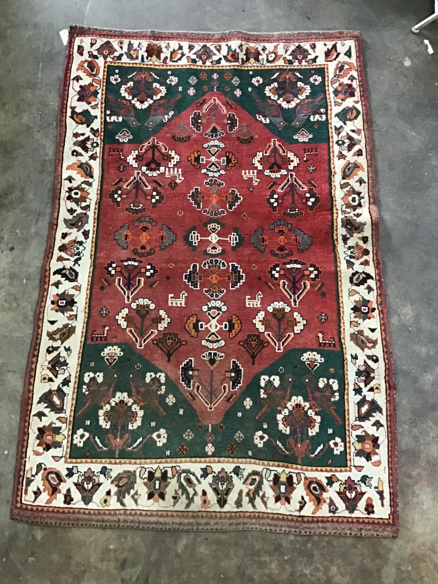 A Turkish brick red ground rug, 194 x 124cm